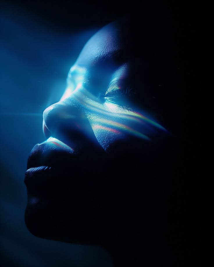 Profile portrait with prismatic light across the face, representing mental clarity
