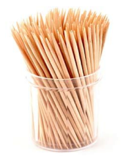 Glass jar filled with traditional wooden toothpicks
